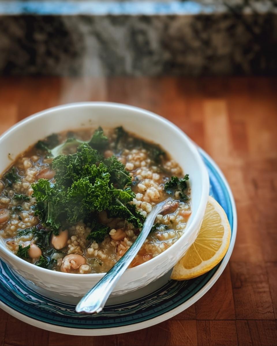 A steaming bowl of hearty kale and bean soup, a delicious example of traditional soups with modern twists.